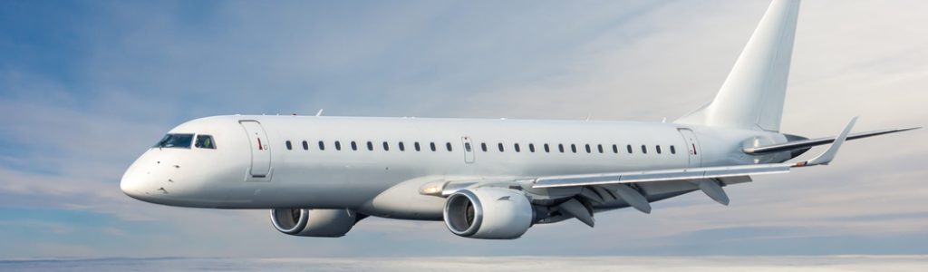 Modern,White,Passenger,Jetliner,Flies,In,The,Sky,Above,The